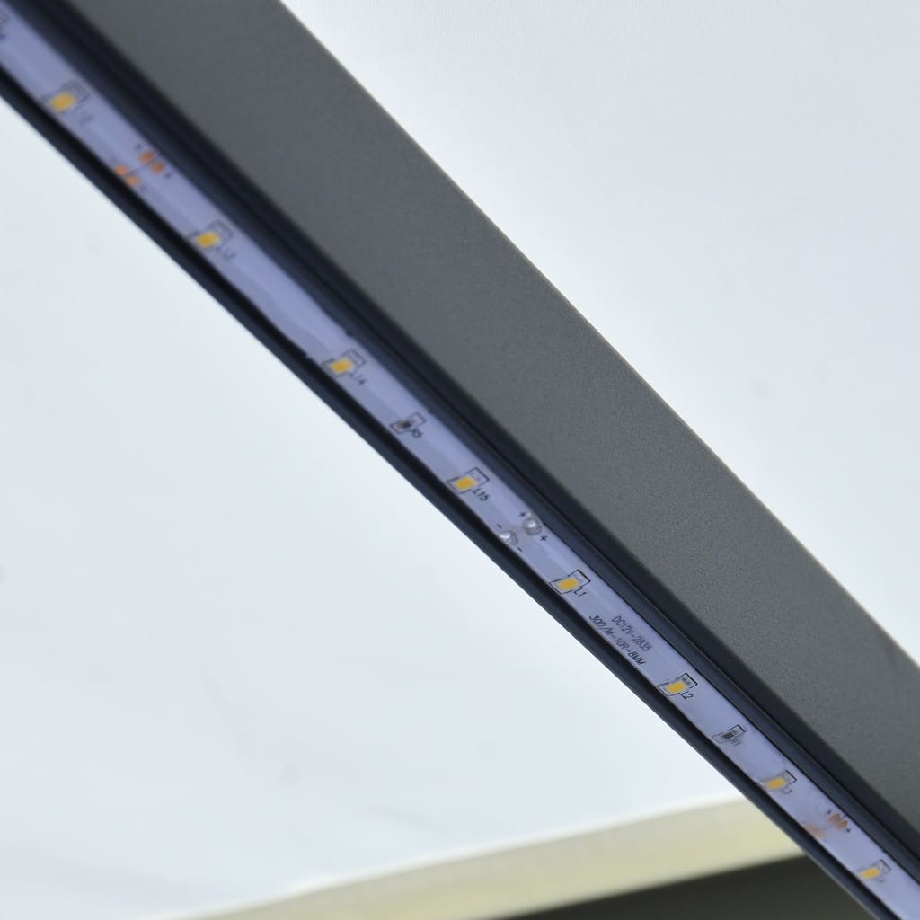 vidaXL Manuell uttrekkbar markise med LED 600x300 cm kremhvit